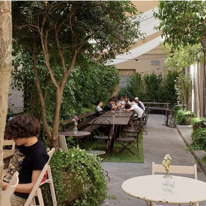 Tables in a garden restaurant in Florence